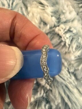 Curved 14 k white gold with diamonds.